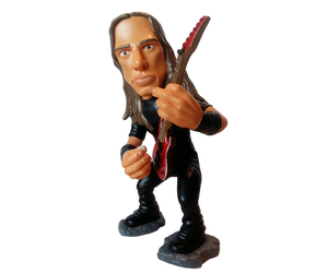 Figurine of a long haired man dressed in black playing a red guitar.
